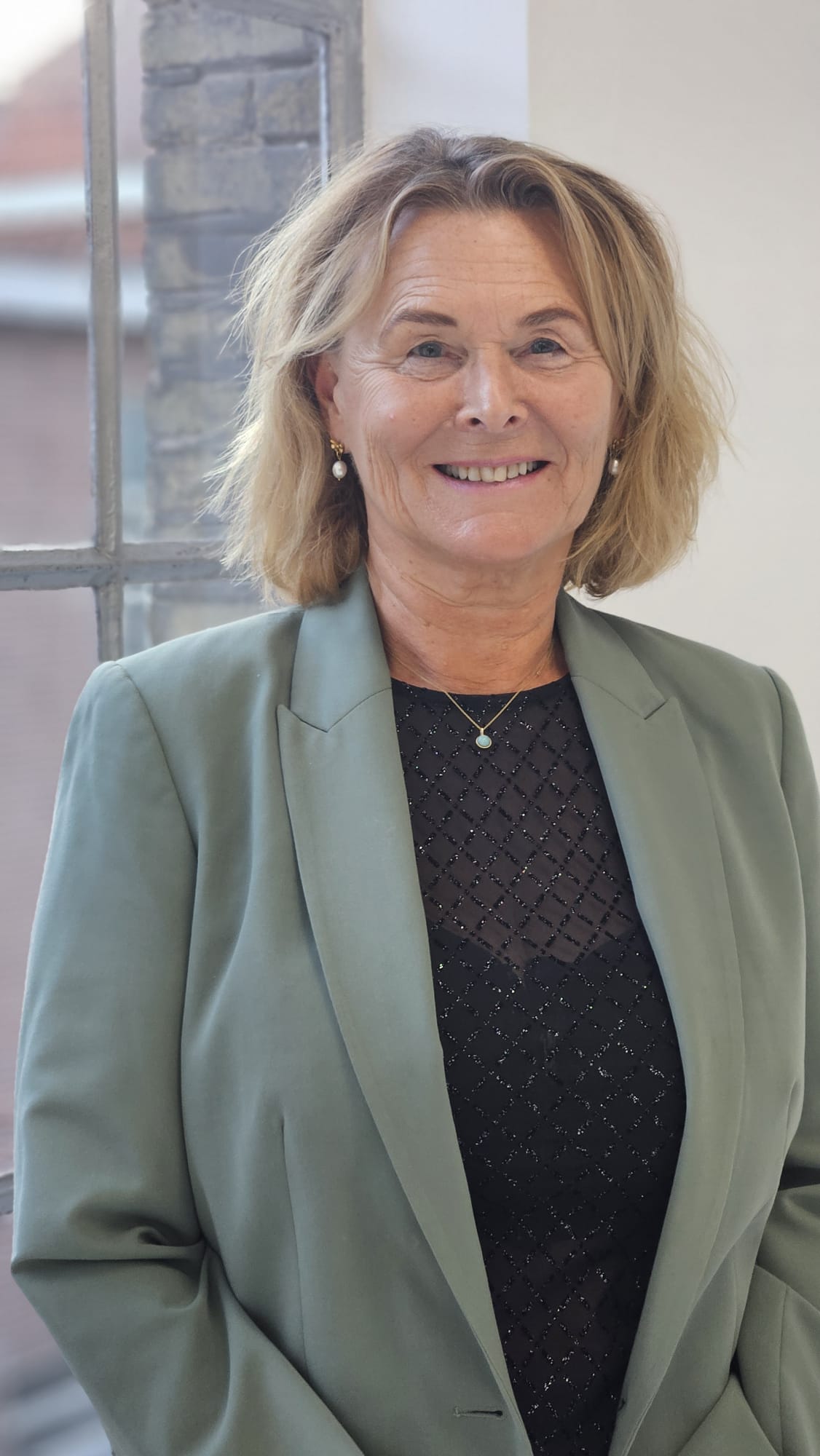 Portret van Yvonne de Wagt in een groen jasje